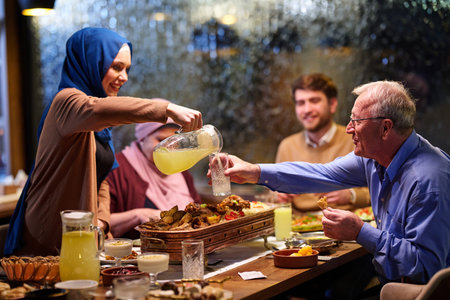 Muslim family enjoys iftar together in a restaurant decorated for Ramadan