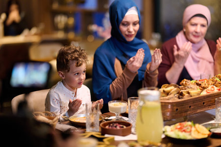 Muslim family gathers in restaurant to break fast together during Ramadan celebration