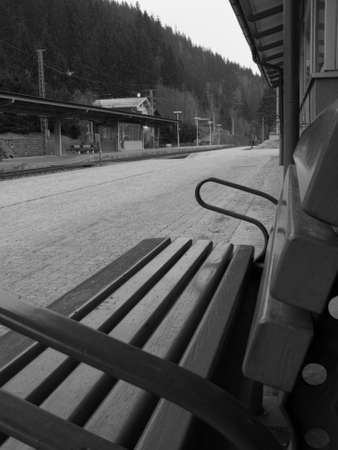 An empty bench on the station platform at Bad Gastein, Austria.の写真素材