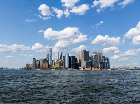 Sunny view of skyscrapers in Financial District, Manhattan from Hudson Riverのeditorial素材