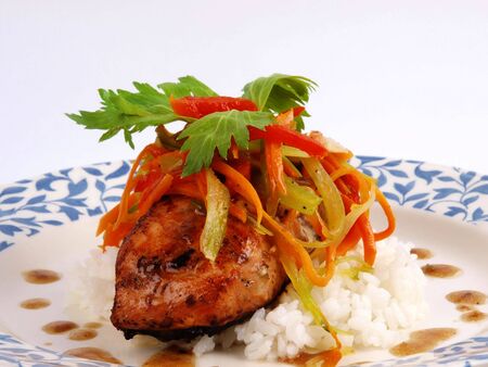 Fried salmon on a plate, close up on white backgroundの写真素材