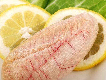 Fresh cod roe close up with lemon, salad. White backgroundの写真素材