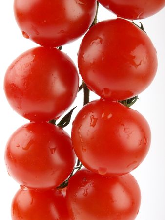 Fresh tomatoes close up on white backgroundの写真素材