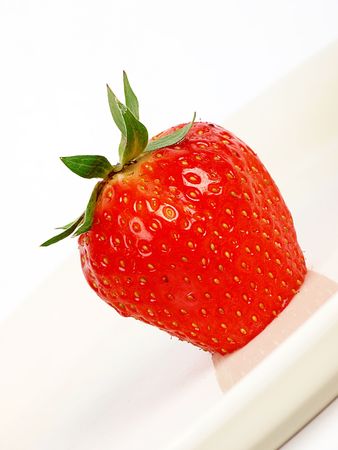 Strawberry close up on a cream cake. white backgroundの写真素材