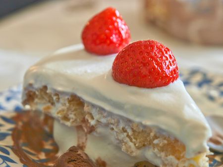 Strawberry close up on a cream cake. white backgroundの写真素材