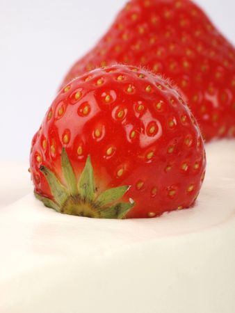 Strawberry close up on a cream cake. white backgroundの写真素材