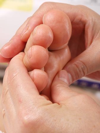 Female hands giving zone therapy. Close upの写真素材