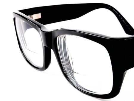 Black retro eyeglasses. Close up on white background の写真素材