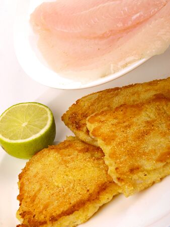 Fish Filet with lemon. Close up on white backgroundの写真素材