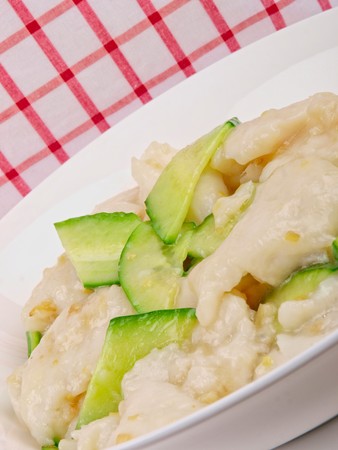 fried white fish with cucumber. Close upの写真素材