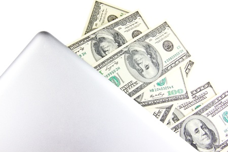 Laptop with hundred dollar notesの写真素材