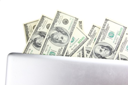 Laptop with hundred dollar notesの写真素材