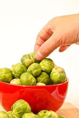 Fresh Brussels sprouts in a bowlの写真素材