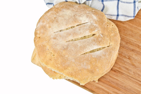 Fresh baked home made bread. Close up on white background