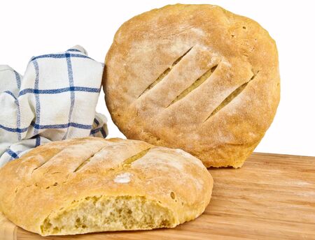 Fresh baked home made bread. Close up on white backgroundの写真素材