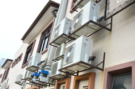 Perlis, Malaysia: October 5, 2022 - Air conditioner on wall outside the house.のeditorial素材