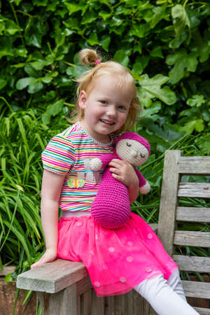 Smiling Young Redhair Girl In The Gardenの写真素材