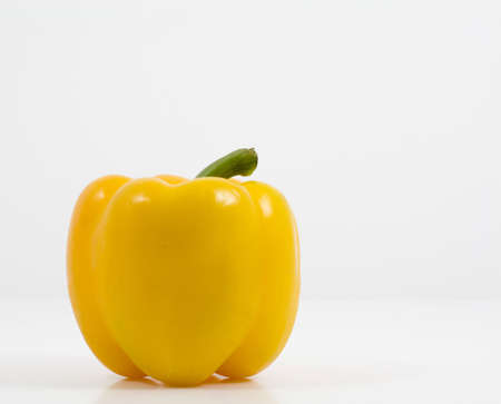 yellow peperone on a white backgroundの写真素材