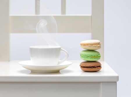 Three macaroon biscuits and hot drinkの写真素材