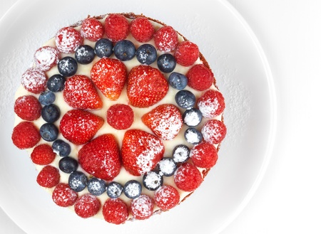 Cake with strawberries, raspberries and blueberries, high angleの写真素材