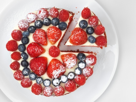 Cake with strawberries, raspberries and blueberries, high angleの写真素材