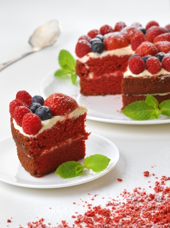 Piece of red velvet cake on plate, studio shotの写真素材