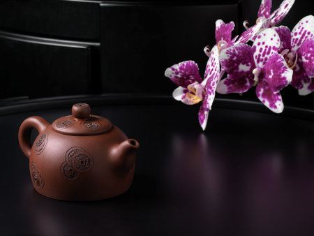 Traditional Chinese teapot with orchid flowers