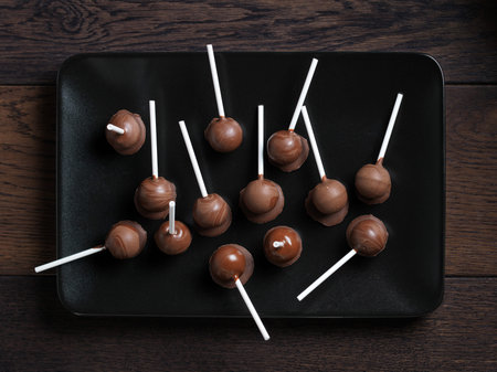 Homemade chocolate lollipops, studio shot