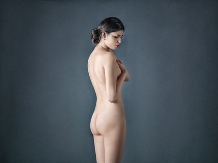 Studio photo of nude brunette girlの写真素材