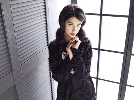 Brunette woman wearing black blouse and skirtの写真素材
