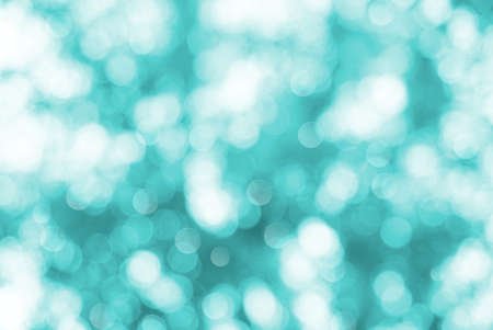 blue and white blur bokeh abstract background, snow or winter effect backgroundの写真素材