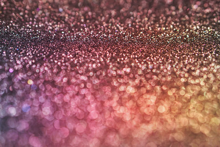 colorful purple pink yellow bokeh light glitter background for Christmas and New Year festivalの写真素材