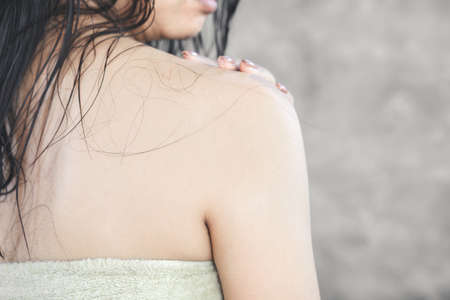 hair loss problem falling on Asian woman back after showerの写真素材
