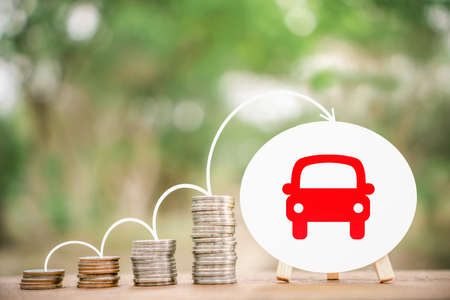 stack of coin or saving money to buy new car ,loan from car concept backgroundの写真素材