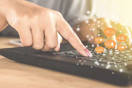 business woman hand using computer laptop for social media technology background