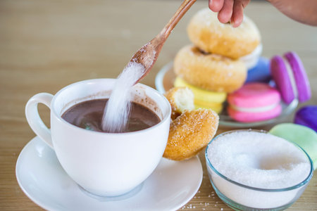 sugar addiction concept with unhealthy woman eating sweet drink and many desserts