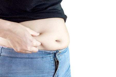 fat overweight woman with big belly  ,  isolated on white backgroundの写真素材