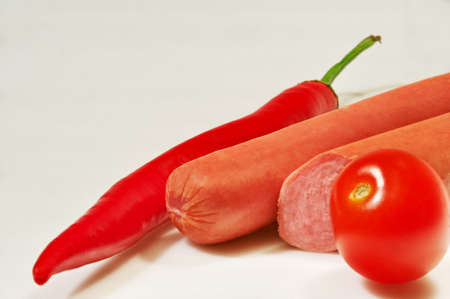 Hot chilli pepper, sausages and tomatoの写真素材