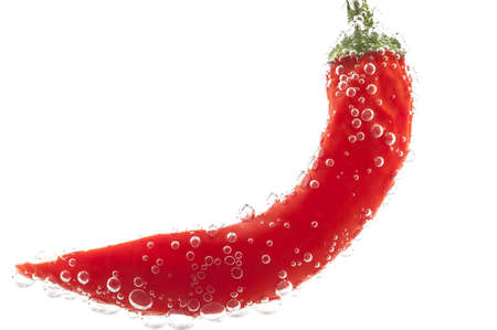 Hot chilli pepper and bubbles  on a white backgroundの写真素材