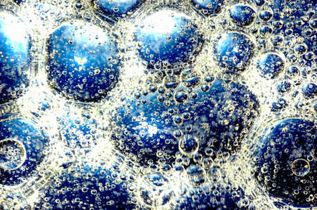 Oil drops on a water surface の写真素材