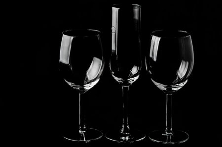 Set of different empty glasses on a black backgroundの写真素材