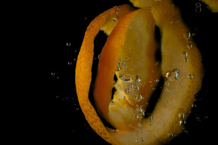 Orange in water on a black backgroundの写真素材