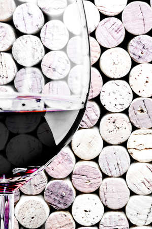 Wine glass on corks backgroundの写真素材