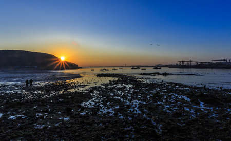 Sunrise at Yan Dun Jiao  Swan Lake の写真素材