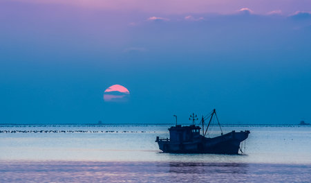 fishing boat in the seaの写真素材