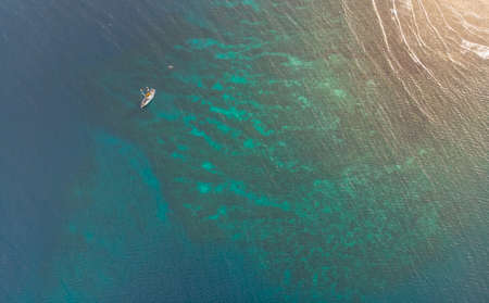 Sailboat On Caribbean Coral Reefの写真素材