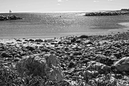 view of the ocean and rocky shore of new england.