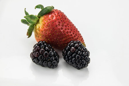 strawberry with two raspberries,の写真素材