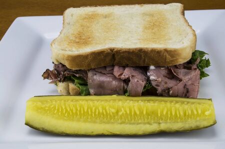 roast beef sandwich with a pickleの写真素材