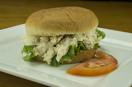 tuna fish on a bun with lettuce and tomato.の写真素材